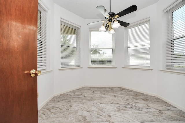 3515 Kansas St, Fresno, TX 77545 - unfurnished room with healthy amount of natural light, ceiling fan, and marble finish floors