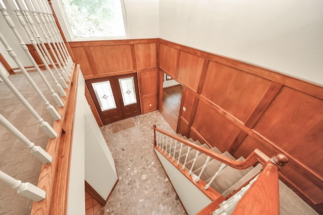 3515 Kansas St, Fresno, TX 77545 - entrance foyer featuring stairs, a wainscoted wall, a decorative wall, and french doors