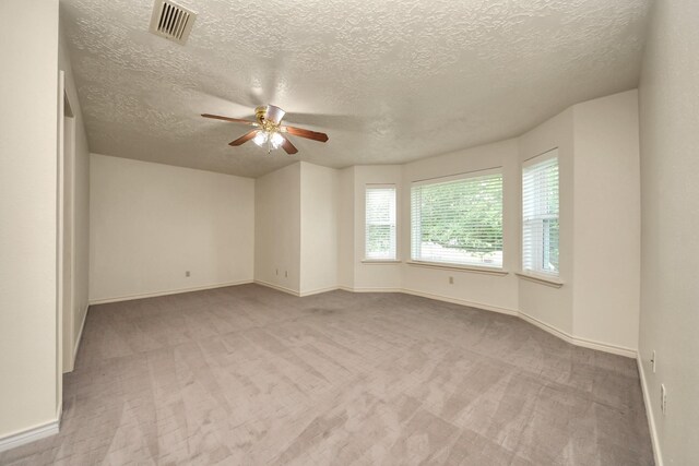 3515 Kansas St, Fresno, TX 77545 - carpeted empty room with a ceiling fan and a textured ceiling