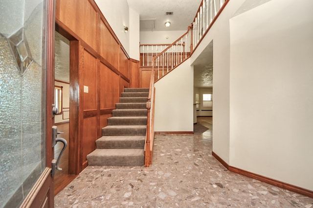 3515 Kansas St, Fresno, TX 77545 - staircase featuring baseboards and a high ceiling