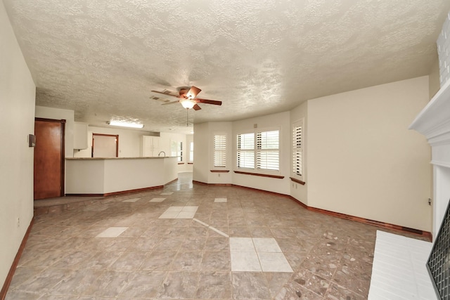 3515 Kansas St, Fresno, TX 77545 - unfurnished living room with ceiling fan, a textured ceiling, and light tile patterned flooring