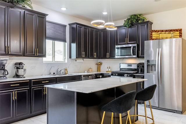 15903 Smithland Dr, Houston, TX 77084 - kitchen featuring stainless steel appliances, light stone countertops, decorative backsplash, a kitchen island, and recessed lighting