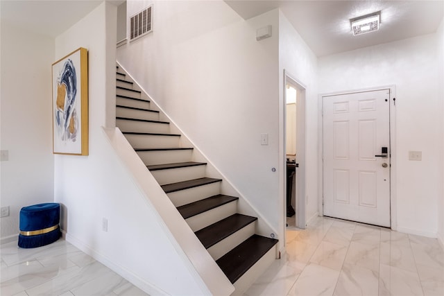 15903 Smithland Dr, Houston, TX 77084 - foyer with marble finish flooring and stairs