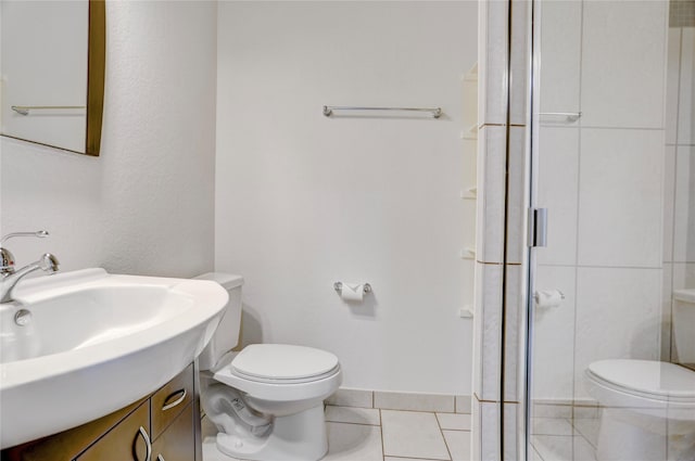 2904 Chenevert St Unit J, Houston, TX 77004 - full bath featuring a stall shower, tile patterned flooring, and vanity