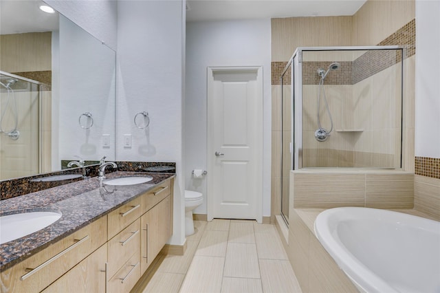 2904 Chenevert St Unit J, Houston, TX 77004 - bathroom with a stall shower, a garden tub, double vanity, and tile patterned flooring