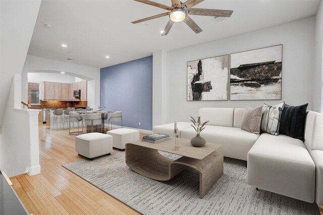 2904 Chenevert St Unit J, Houston, TX 77004 - living area with recessed lighting, light wood finished floors, a ceiling fan, and arched walkways