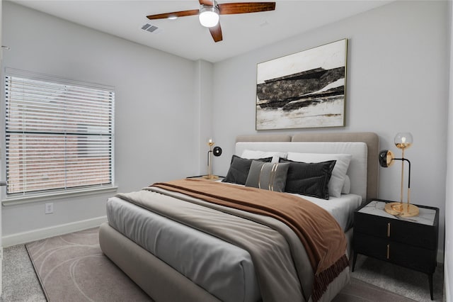 2904 Chenevert St Unit J, Houston, TX 77004 - carpeted bedroom featuring baseboards and a ceiling fan