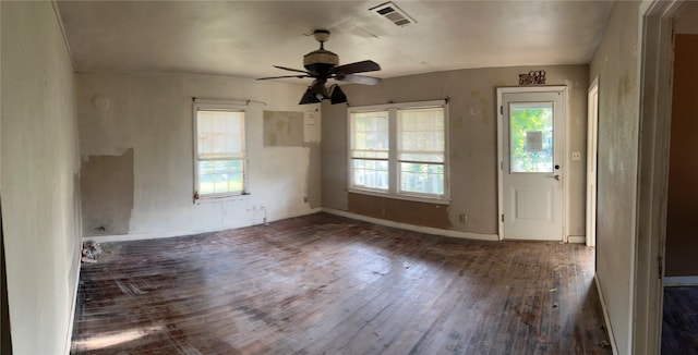 107 Russell St, Liberty Hill, TX 78642 - unfurnished room with hardwood / wood-style flooring, healthy amount of natural light, and ceiling fan