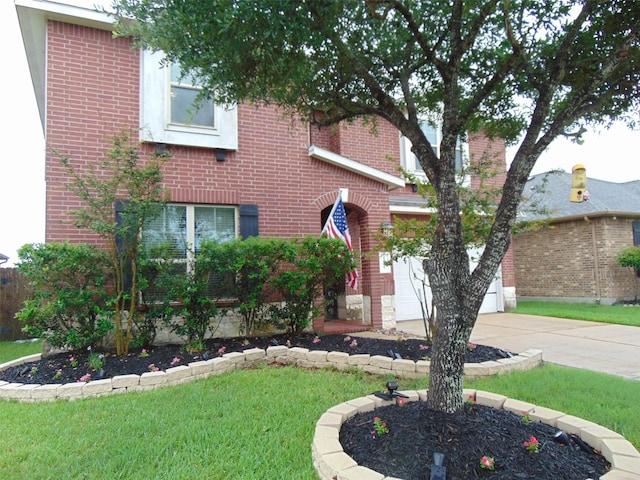 23727 Scotsman Dr, Katy, TX 77493 - traditional-style home featuring concrete driveway, brick siding, and a front yard