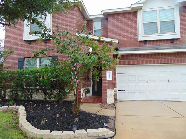23727 Scotsman Dr, Katy, TX 77493 - view of front of house with brick siding, an attached garage, and concrete driveway
