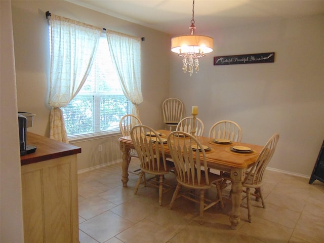 23727 Scotsman Dr, Katy, TX 77493 - dining room featuring a chandelier and light tile patterned floors