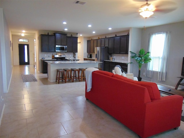23727 Scotsman Dr, Katy, TX 77493 - living area featuring recessed lighting, ceiling fan, and light tile patterned floors