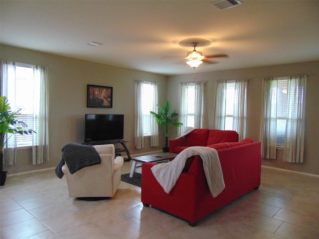 23727 Scotsman Dr, Katy, TX 77493 - living area with a ceiling fan and light tile patterned floors