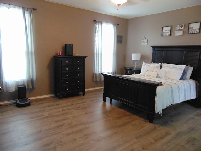 23727 Scotsman Dr, Katy, TX 77493 - bedroom featuring light wood-type flooring and a ceiling fan