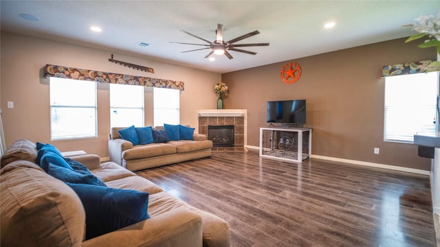 18527 Grove Brook Ln, Cypress, TX 77429 - living area with ceiling fan, healthy amount of natural light, wood finished floors, recessed lighting, and a tile fireplace