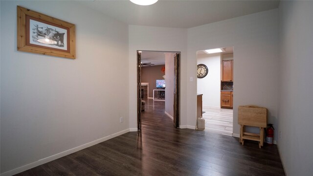 18527 Grove Brook Ln, Cypress, TX 77429 - hallway featuring wood finished floors and baseboards