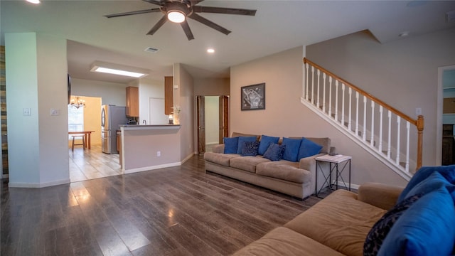 18527 Grove Brook Ln, Cypress, TX 77429 - living room with a chandelier, a ceiling fan, wood finished floors, recessed lighting, and stairway