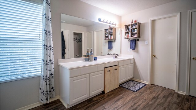 18527 Grove Brook Ln, Cypress, TX 77429 - bathroom with vanity and wood finished floors
