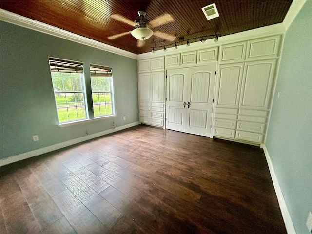 5119 33rd St, Groves, TX 77619 - unfurnished bedroom with ornamental molding, dark wood finished floors, track lighting, and ceiling fan
