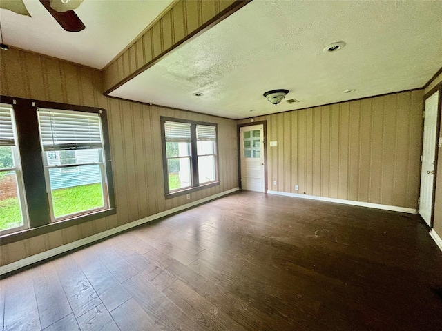 5119 33rd St, Groves, TX 77619 - spare room featuring hardwood / wood-style floors, a textured ceiling, and a ceiling fan