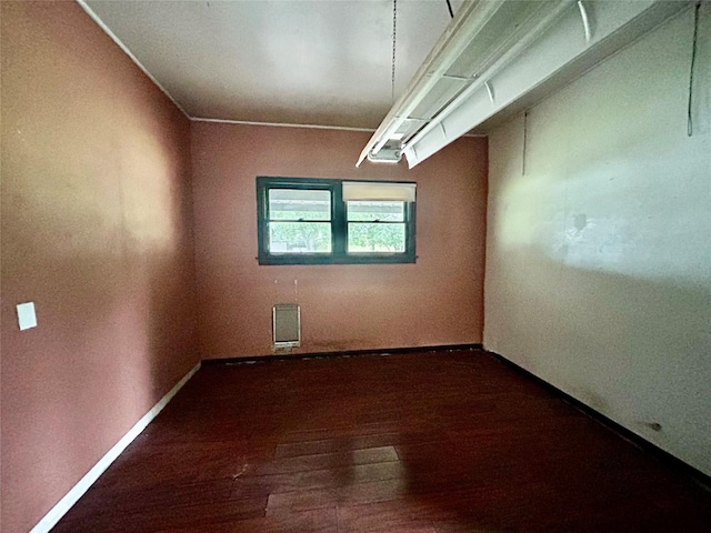 5119 33rd St, Groves, TX 77619 - empty room featuring dark wood-style floors