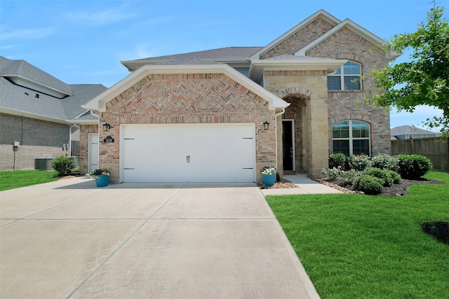 31319 Mallet Cv, Fulshear, TX 77441 - view of front of house with concrete driveway, an attached garage, and brick siding