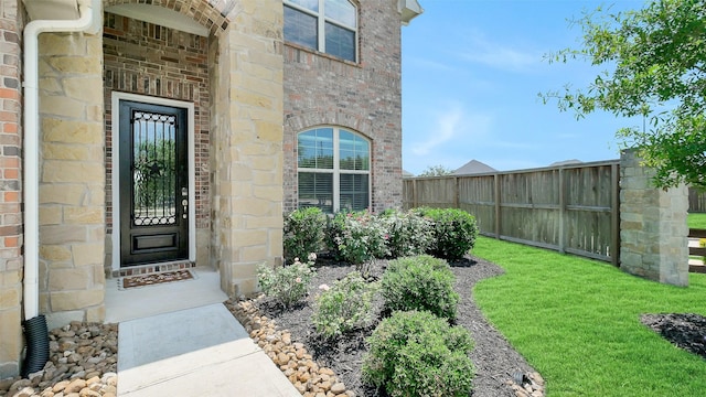 31319 Mallet Cv, Fulshear, TX 77441 - doorway to property featuring brick siding and stone siding