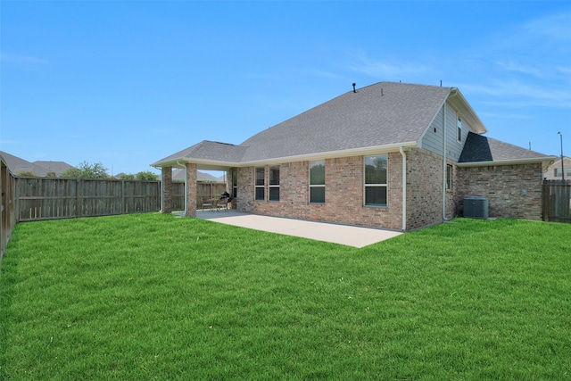 31319 Mallet Cv, Fulshear, TX 77441 - rear view of property with a patio, a fenced backyard, brick siding, and a shingled roof