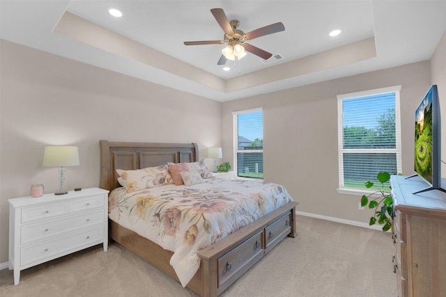 31319 Mallet Cv, Fulshear, TX 77441 - bedroom featuring light carpet, a tray ceiling, recessed lighting, and ceiling fan