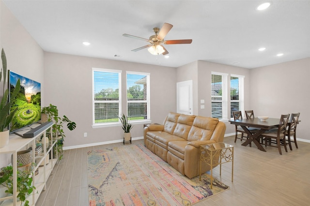 31319 Mallet Cv, Fulshear, TX 77441 - living area featuring healthy amount of natural light, ceiling fan, recessed lighting, and light wood-style floors