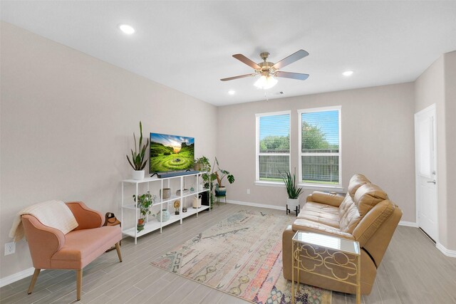 31319 Mallet Cv, Fulshear, TX 77441 - living area with wood finished floors, ceiling fan, and recessed lighting