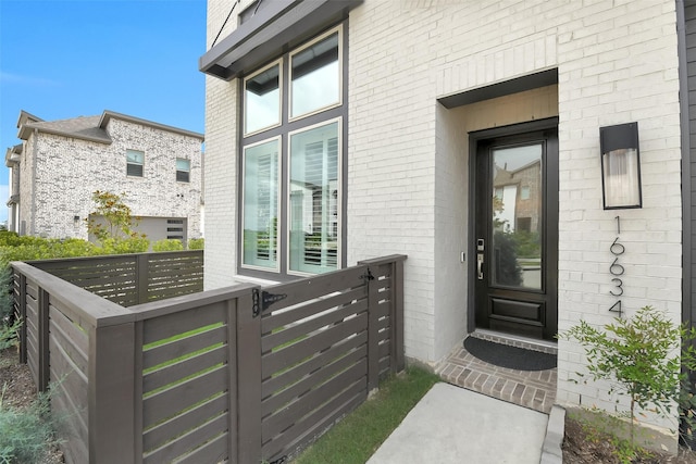 16634 Lake Austin St, Cypress, TX 77433 - doorway to property featuring brick siding