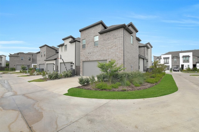 16634 Lake Austin St, Cypress, TX 77433 - view of side of property featuring a residential view, driveway, brick siding, and a garage