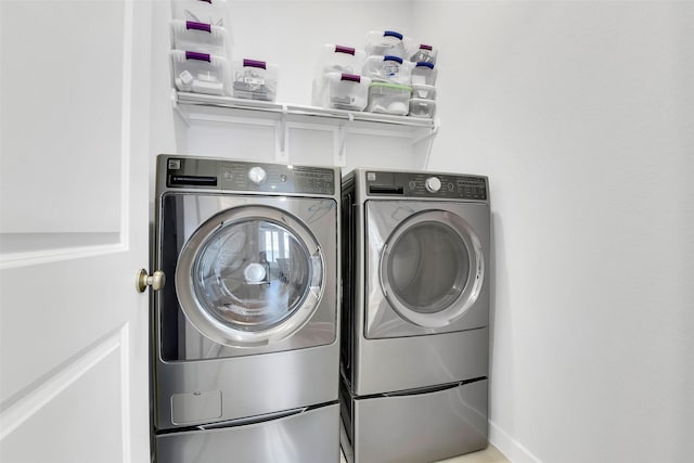 16634 Lake Austin St, Cypress, TX 77433 - laundry room with washer and clothes dryer and baseboards