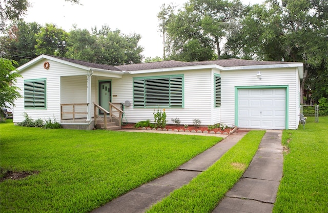 6718 E Bayou Dr, Hitchcock, TX 77563 - view of front facade with driveway, a garage, a front yard, and roof with shingles