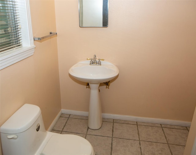 6718 E Bayou Dr, Hitchcock, TX 77563 - half bath with toilet and tile patterned floors