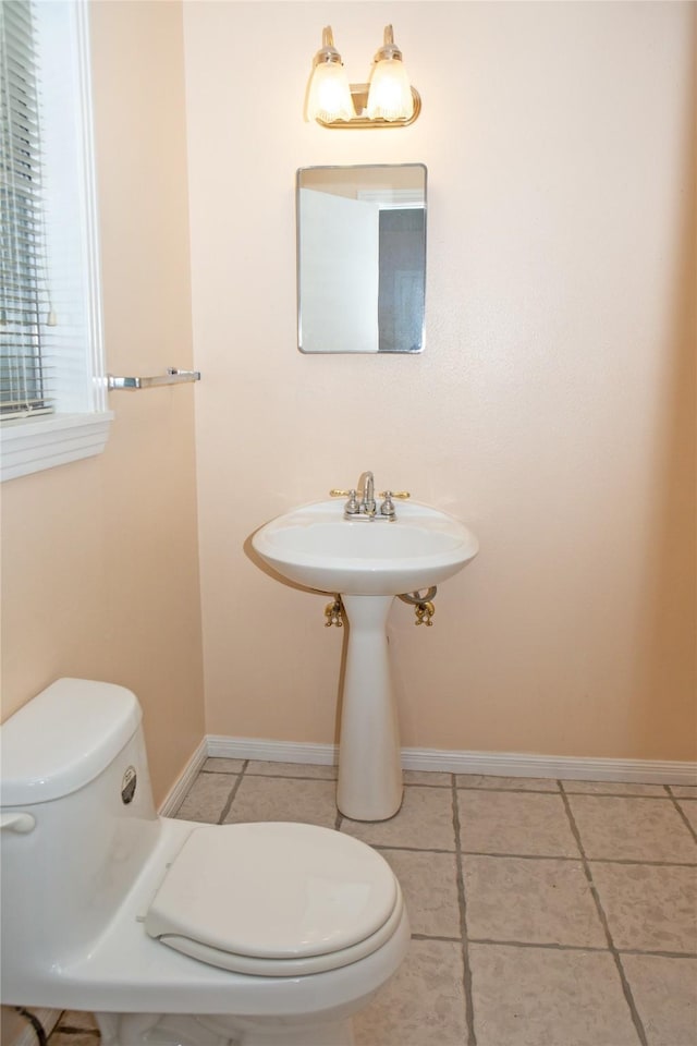 6718 E Bayou Dr, Hitchcock, TX 77563 - bathroom featuring toilet and tile patterned flooring