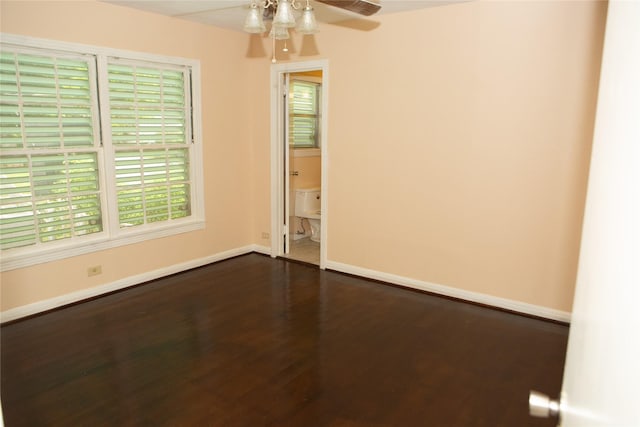 6718 E Bayou Dr, Hitchcock, TX 77563 - empty room with dark wood finished floors and a ceiling fan