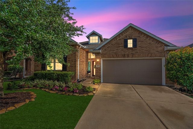 19718 Yellow Hibiscus Ln, Cypress, TX 77433 - view of front of property with brick siding, driveway, a front lawn, and an attached garage