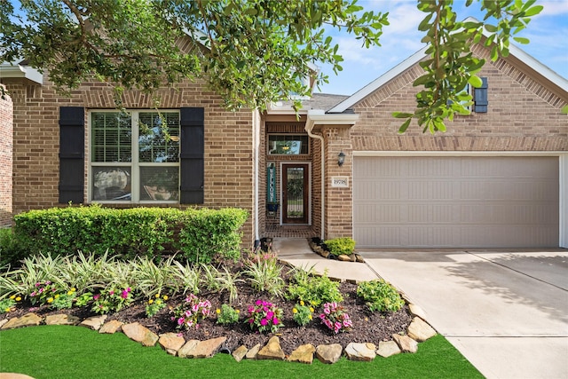 19718 Yellow Hibiscus Ln, Cypress, TX 77433 - view of front of house with brick siding, a garage, and concrete driveway
