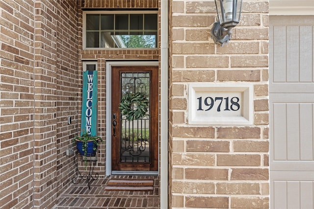 19718 Yellow Hibiscus Ln, Cypress, TX 77433 - doorway to property featuring brick siding