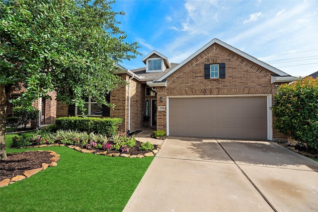 19718 Yellow Hibiscus Ln, Cypress, TX 77433 - view of front facade with brick siding, driveway, a garage, and a front lawn
