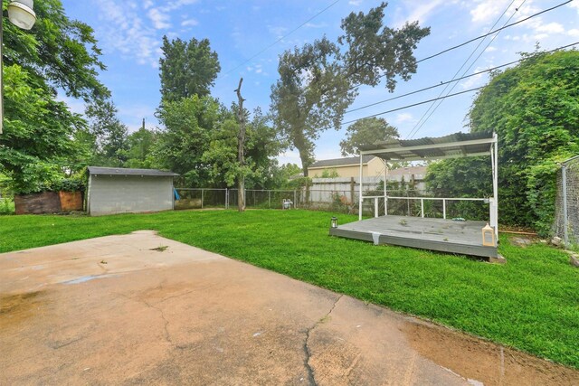 10427 Envoy St, Houston, TX 77016 - fenced backyard featuring a deck, a pergola, an outdoor structure, and a patio area