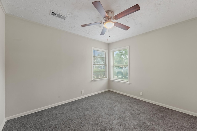 10427 Envoy St, Houston, TX 77016 - unfurnished room with a textured ceiling, dark carpet, and a ceiling fan
