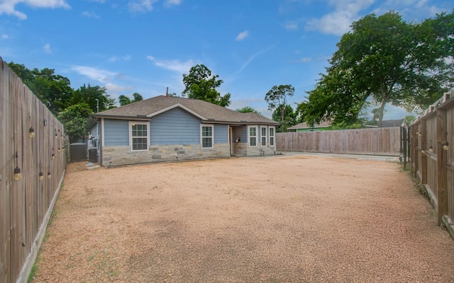 5409 Gold St, Houston, TX 77026 - back of property with stone siding and a fenced backyard