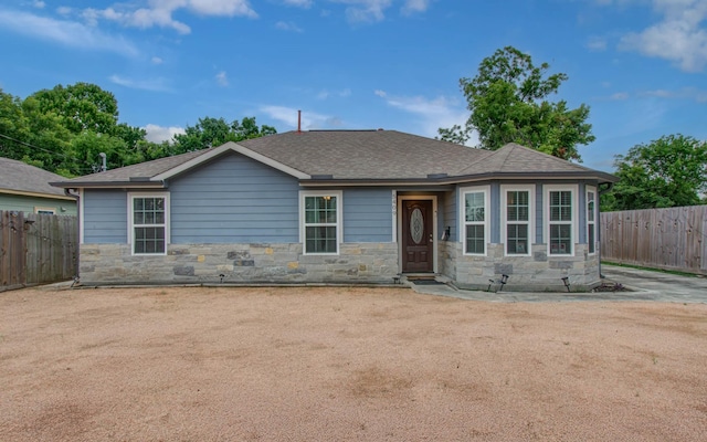 5409 Gold St, Houston, TX 77026 - view of front of property with stone siding and roof with shingles