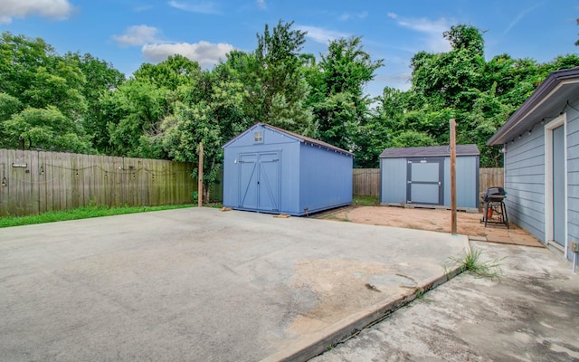 5409 Gold St, Houston, TX 77026 - fenced backyard featuring a shed, a patio area, and grilling area