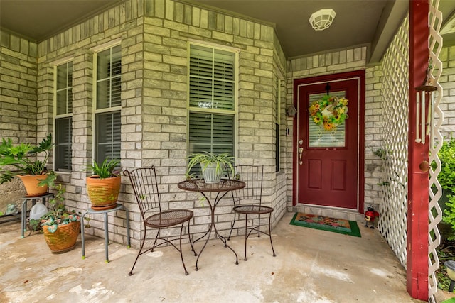 3360 Knob Oaks Dr, Huntsville, TX 77340 - entrance to property with a porch, stone siding, and brick siding