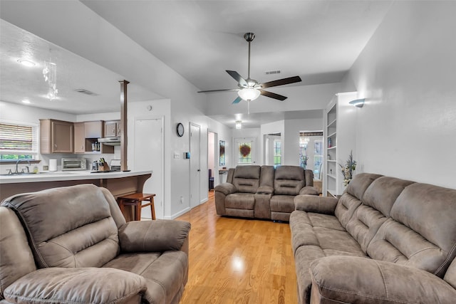 3360 Knob Oaks Dr, Huntsville, TX 77340 - living room with light wood-type flooring, ceiling fan, and plenty of natural light