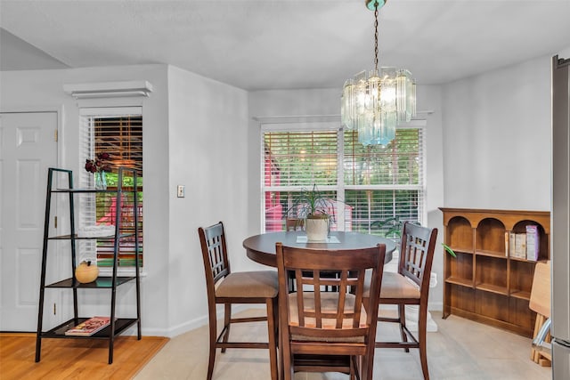 3360 Knob Oaks Dr, Huntsville, TX 77340 - dining area with a chandelier and baseboards